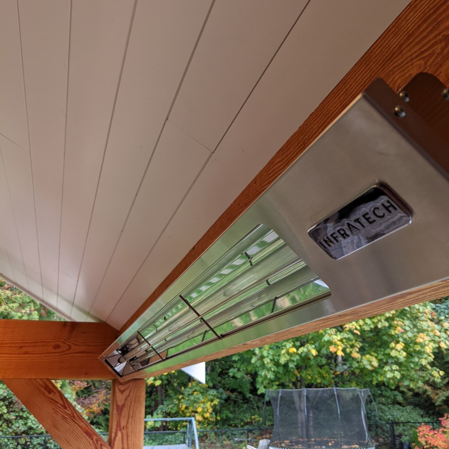 Outdoor patio heater installation on a covered pergola