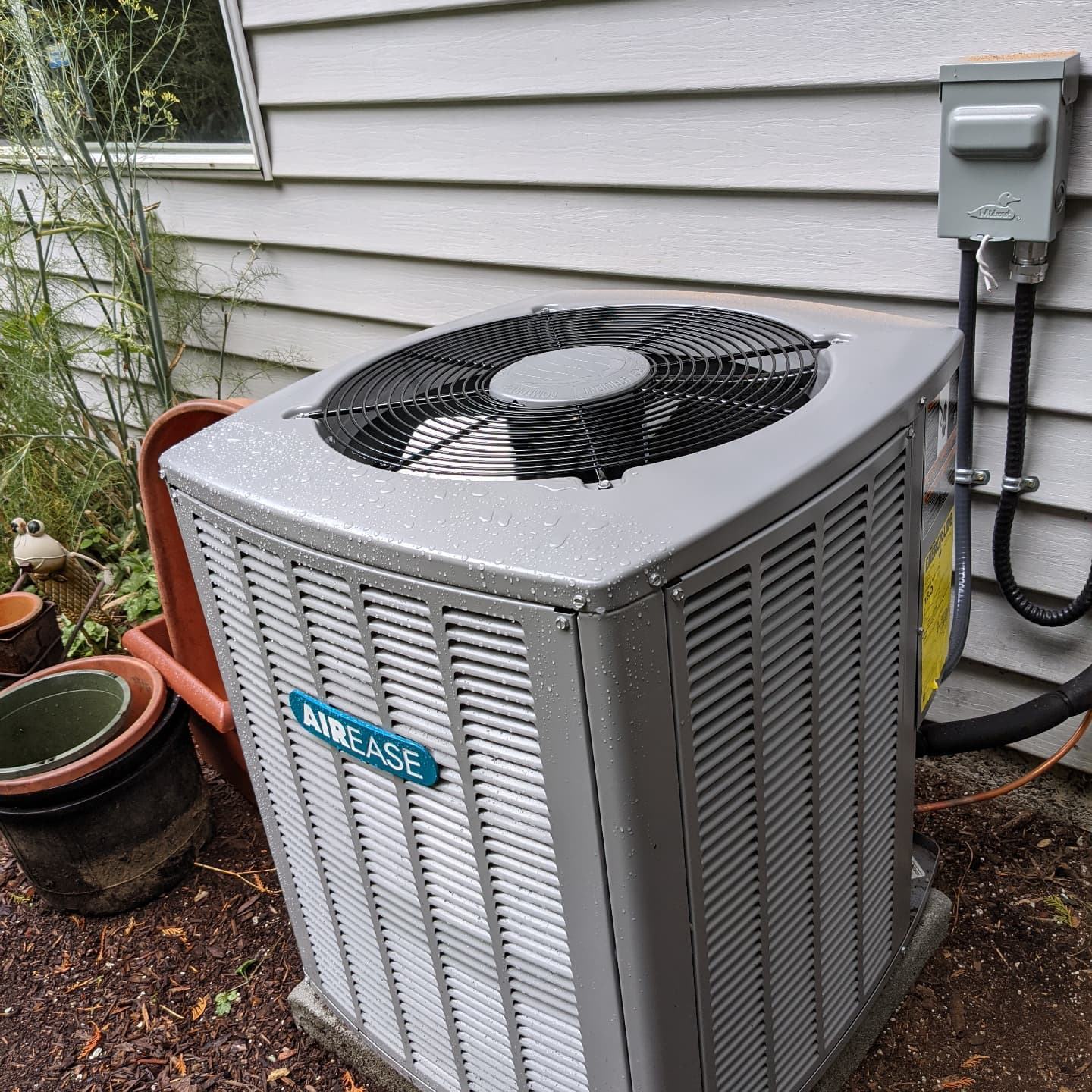 HVAC condenser unit with electrical disconnect and wiring